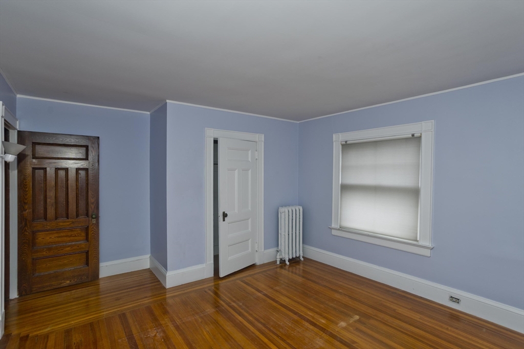 128 Maplewood Terrace Springfield, MA 01108 - Photo 32 of 40 a view of an empty room with wooden floor and closet