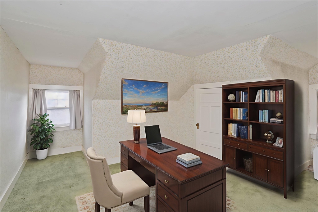 128 Maplewood Terrace Springfield, MA 01108 - Photo 39 of 40 a living room with furniture a bookshelf and a window