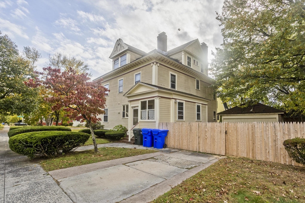 128 Maplewood Terrace Springfield, MA 01108 - Photo 5 of 40 a front view of a house with a yard and trees
