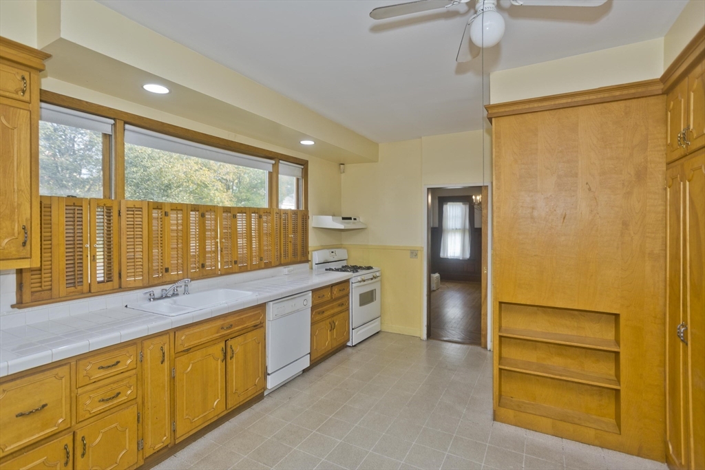 128 Maplewood Terrace Springfield, MA 01108 - Photo 7 of 40 a kitchen with stainless steel appliances granite countertop a refrigerator and a stove