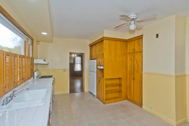 a view of a kitchen with a refrigerator a sink and dishwasher