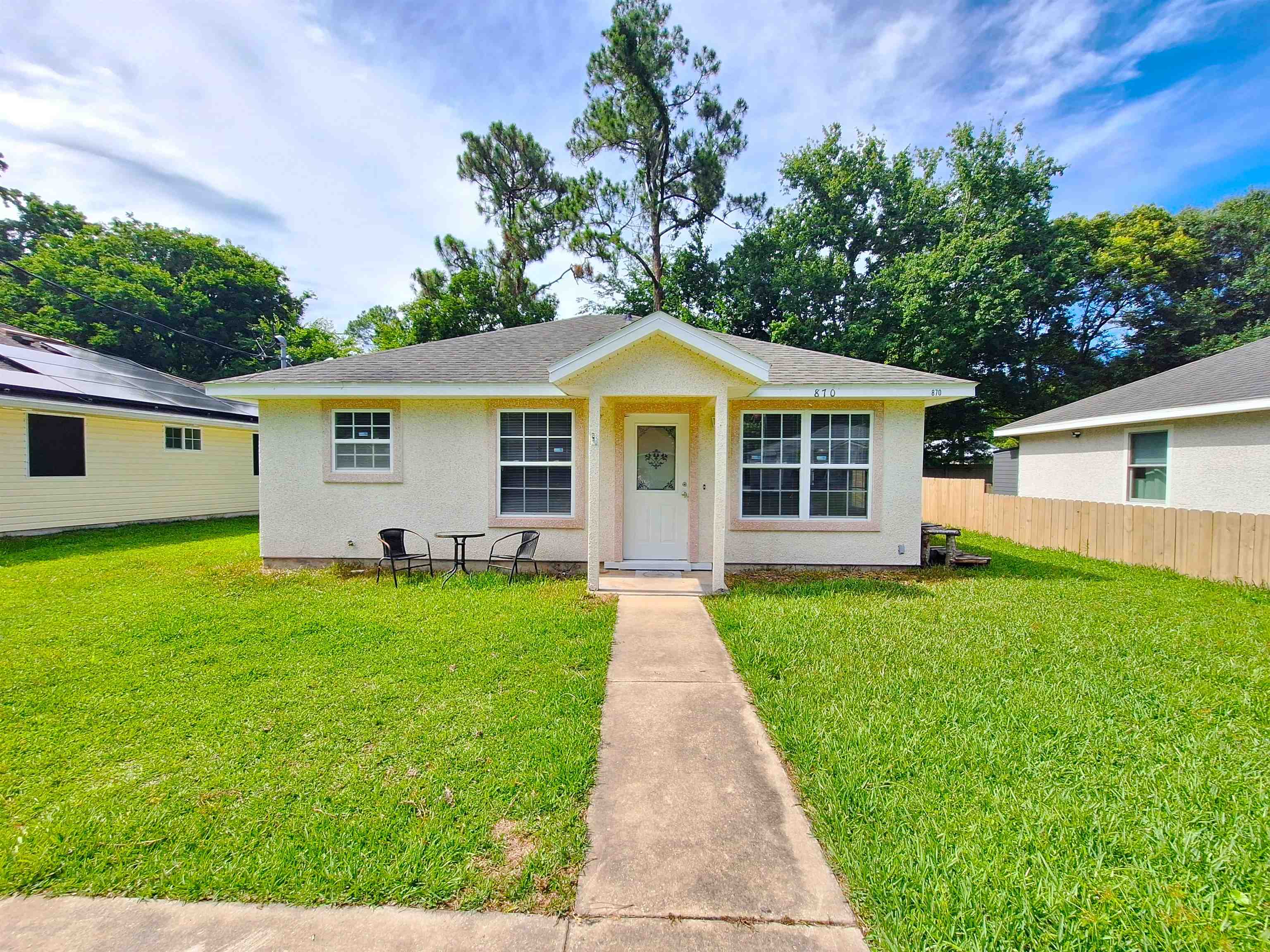 a front view of a house with a yard