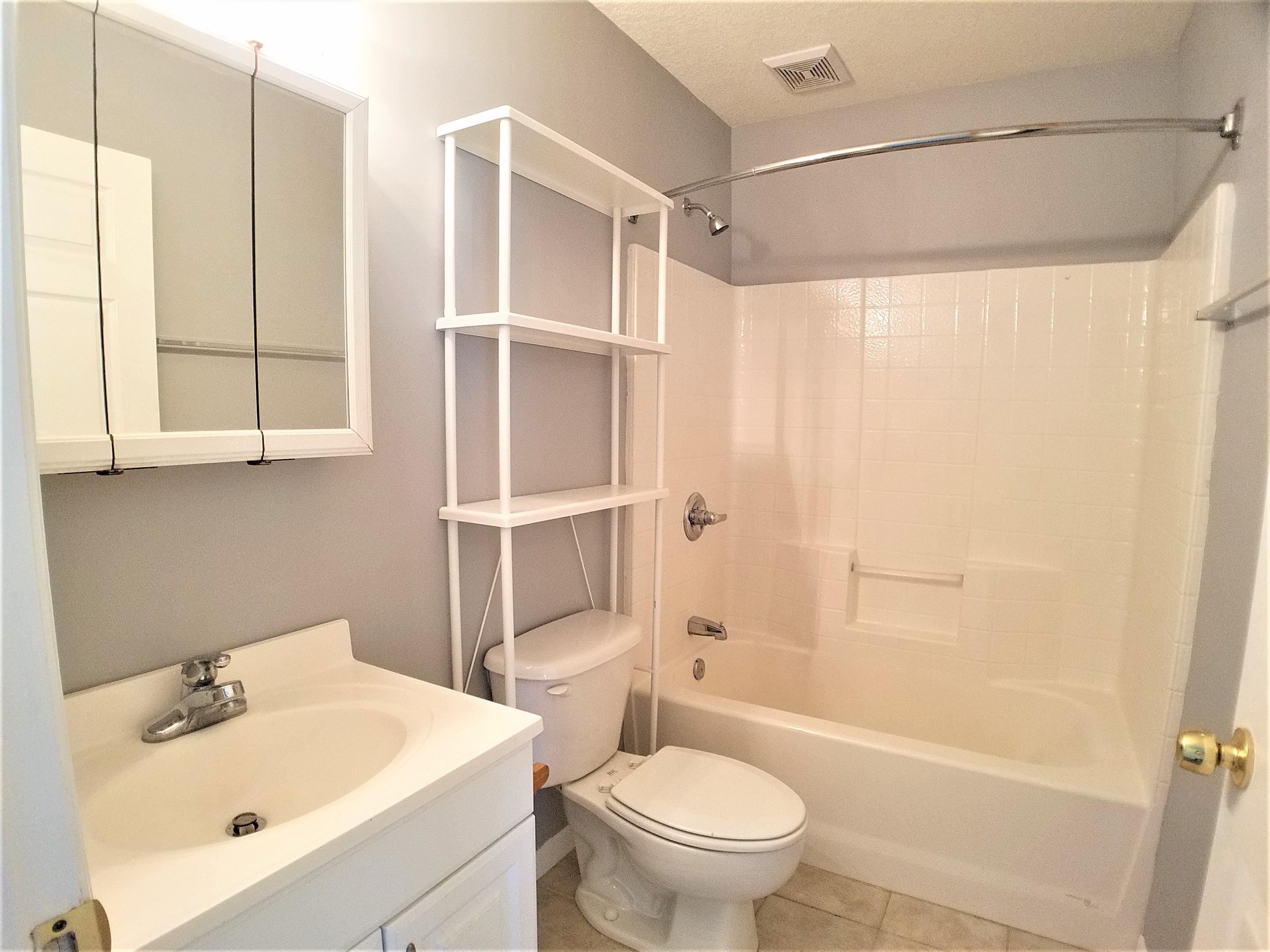 870 13th Street St. Augustine, FL 32084 - Photo 12 of 28 a bathroom with a sink toilet and shower
