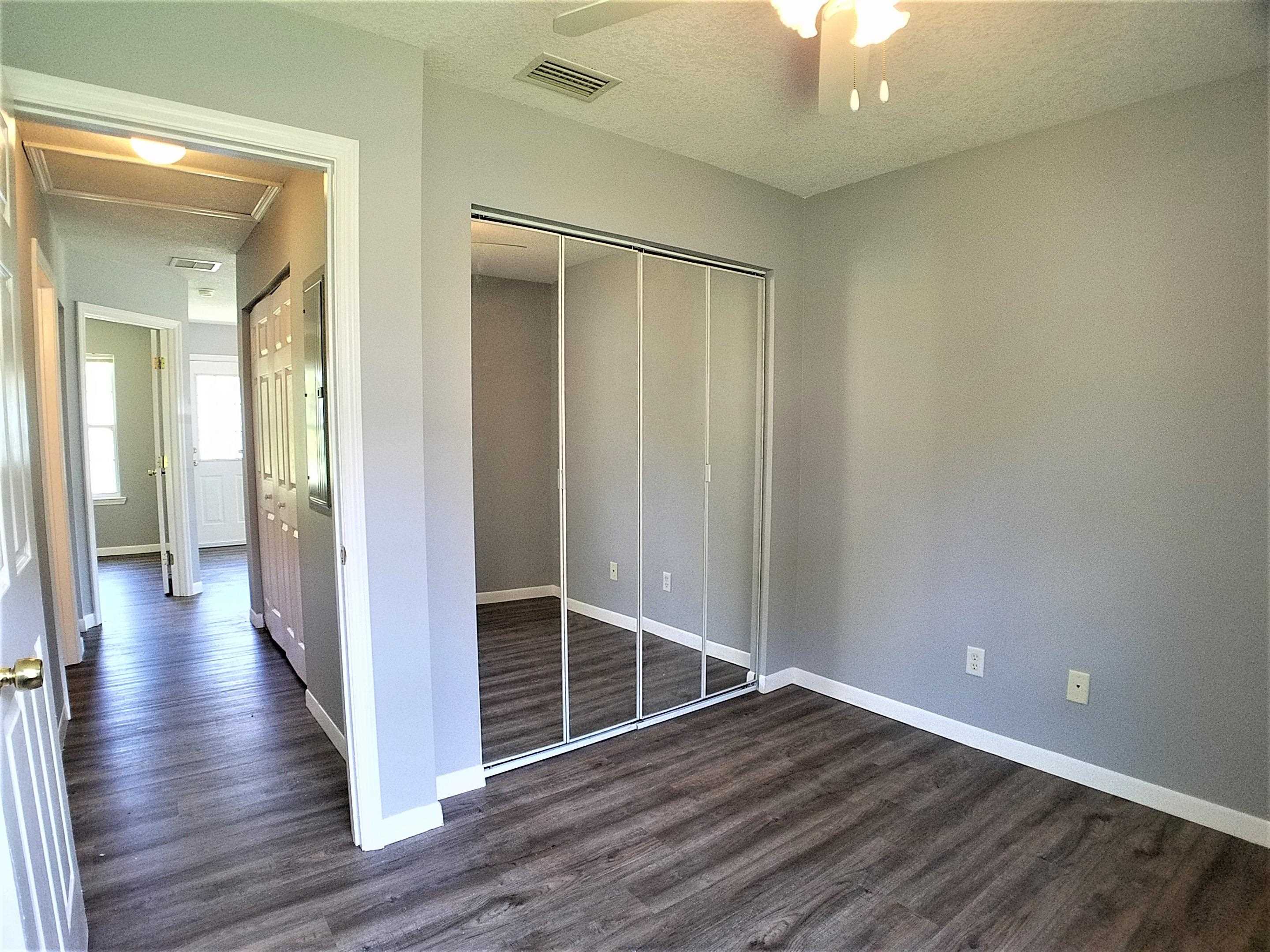 870 13th Street St. Augustine, FL 32084 - Photo 15 of 28 wooden floor in an empty room