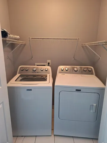 a view of a bathroom from a hallway