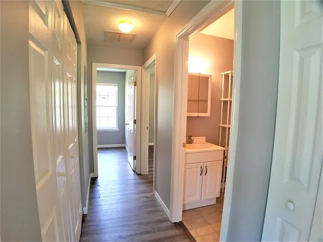 a view of a house with a backyard