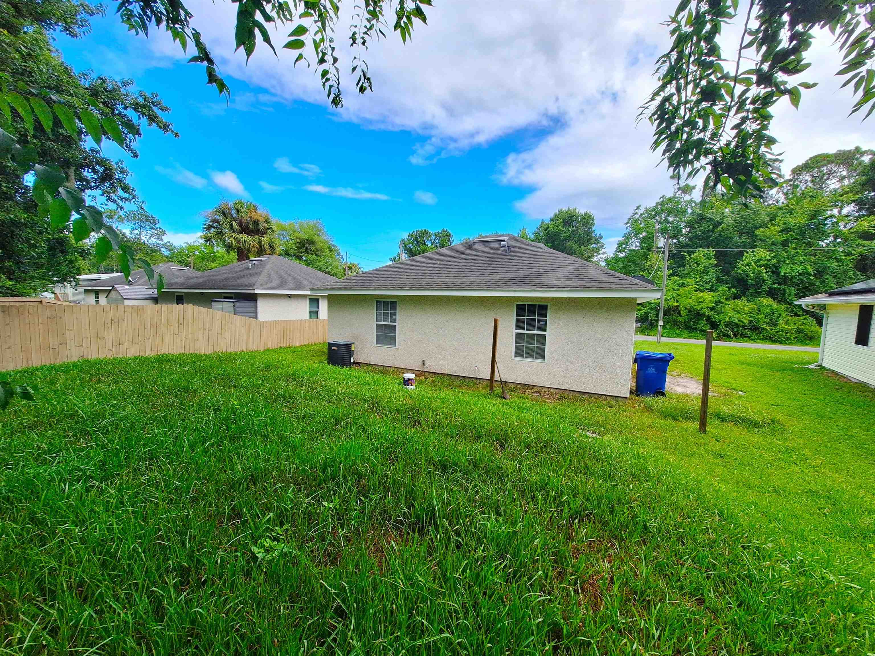 870 13th Street St. Augustine, FL 32084 - Photo 20 of 28 a view of a house with a backyard