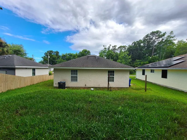 a backyard of a house with lots of green space
