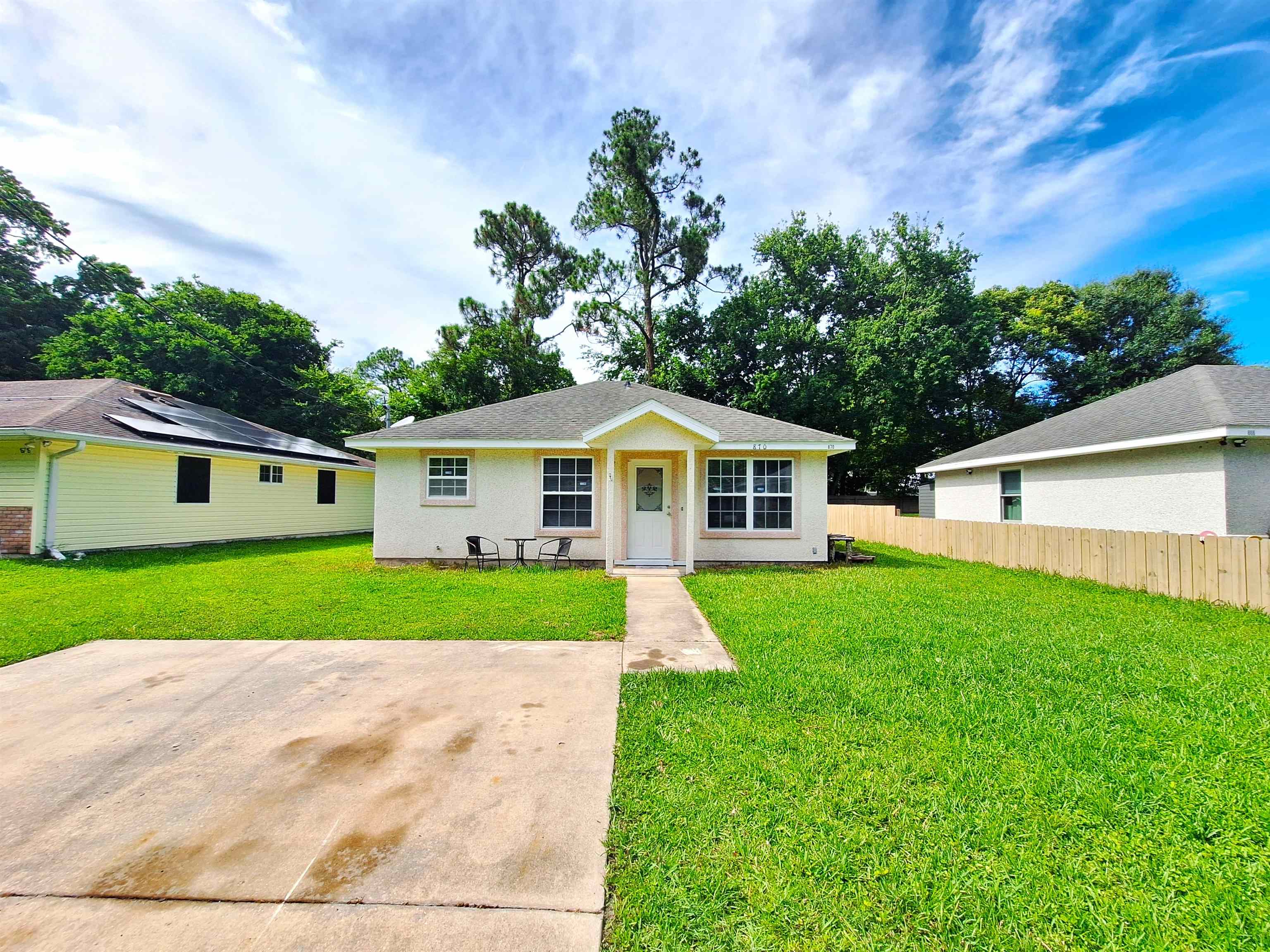 870 13th Street St. Augustine, FL 32084 - Photo 28 of 28 a front view of a house with a yard