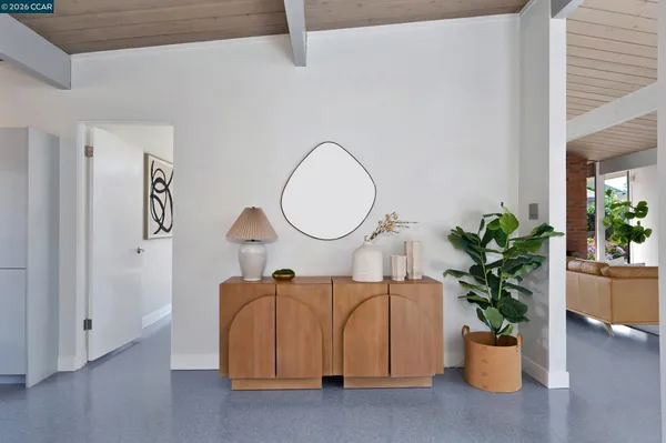 a dining room with furniture and window