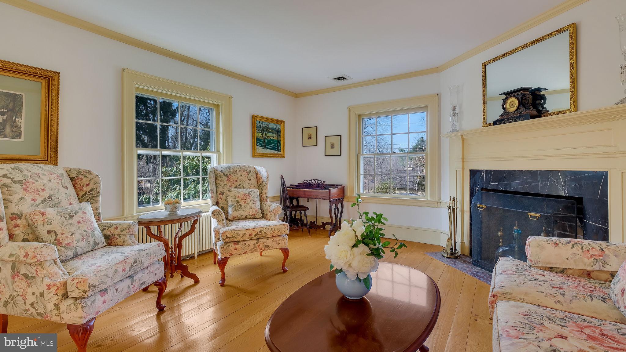 563 Pebble Hill Road Doylestown, PA 18901 - Photo 13 of 81 a living room with furniture large window and a fireplace