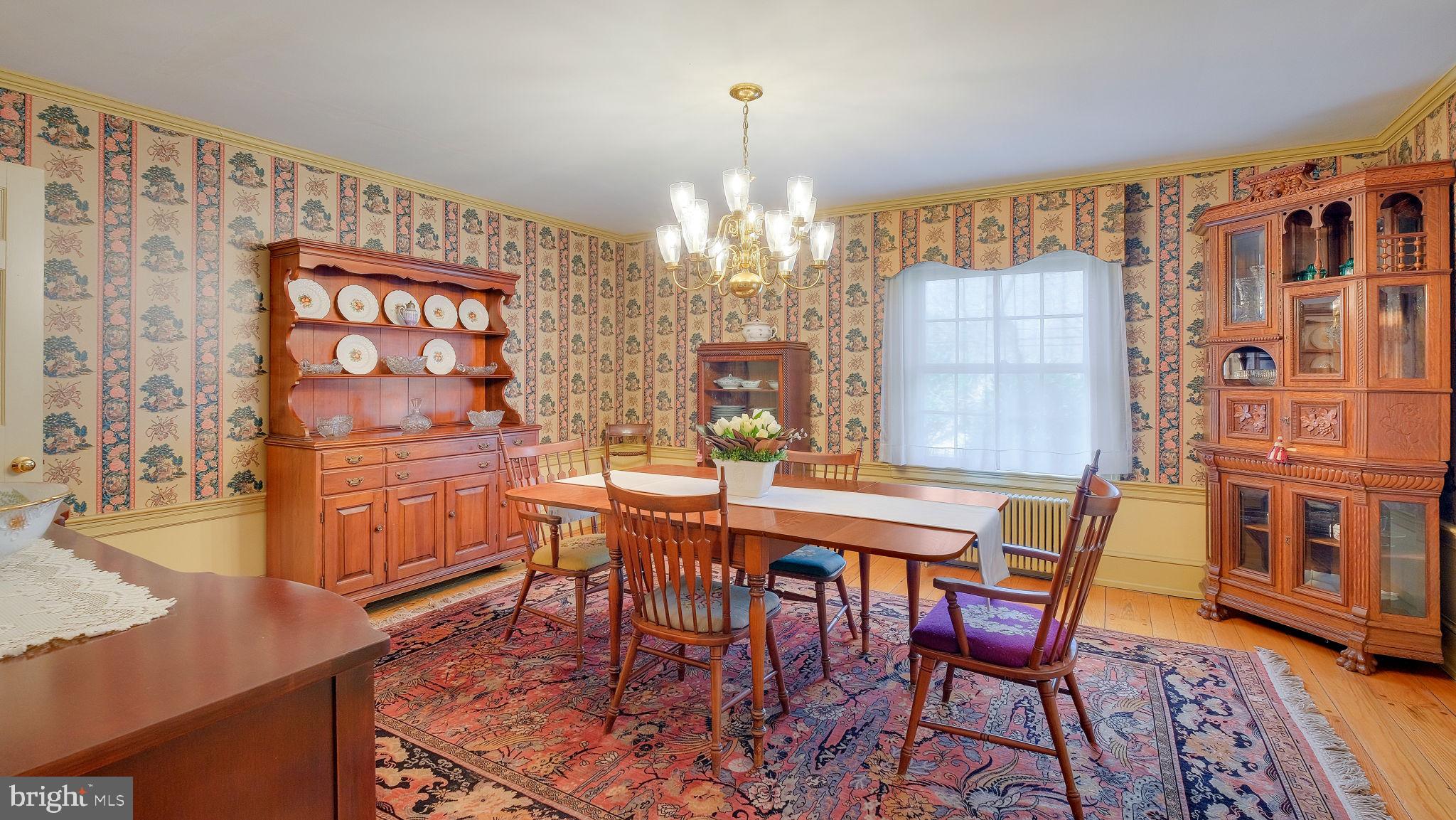 563 Pebble Hill Road Doylestown, PA 18901 - Photo 16 of 81 a view of a dining room with furniture and chandelier