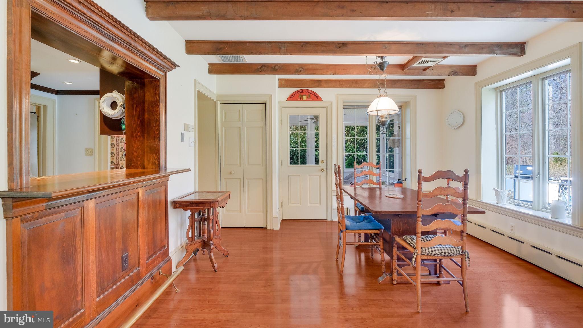 563 Pebble Hill Road Doylestown, PA 18901 - Photo 21 of 81 a dining room with furniture a chandelier and wooden floor