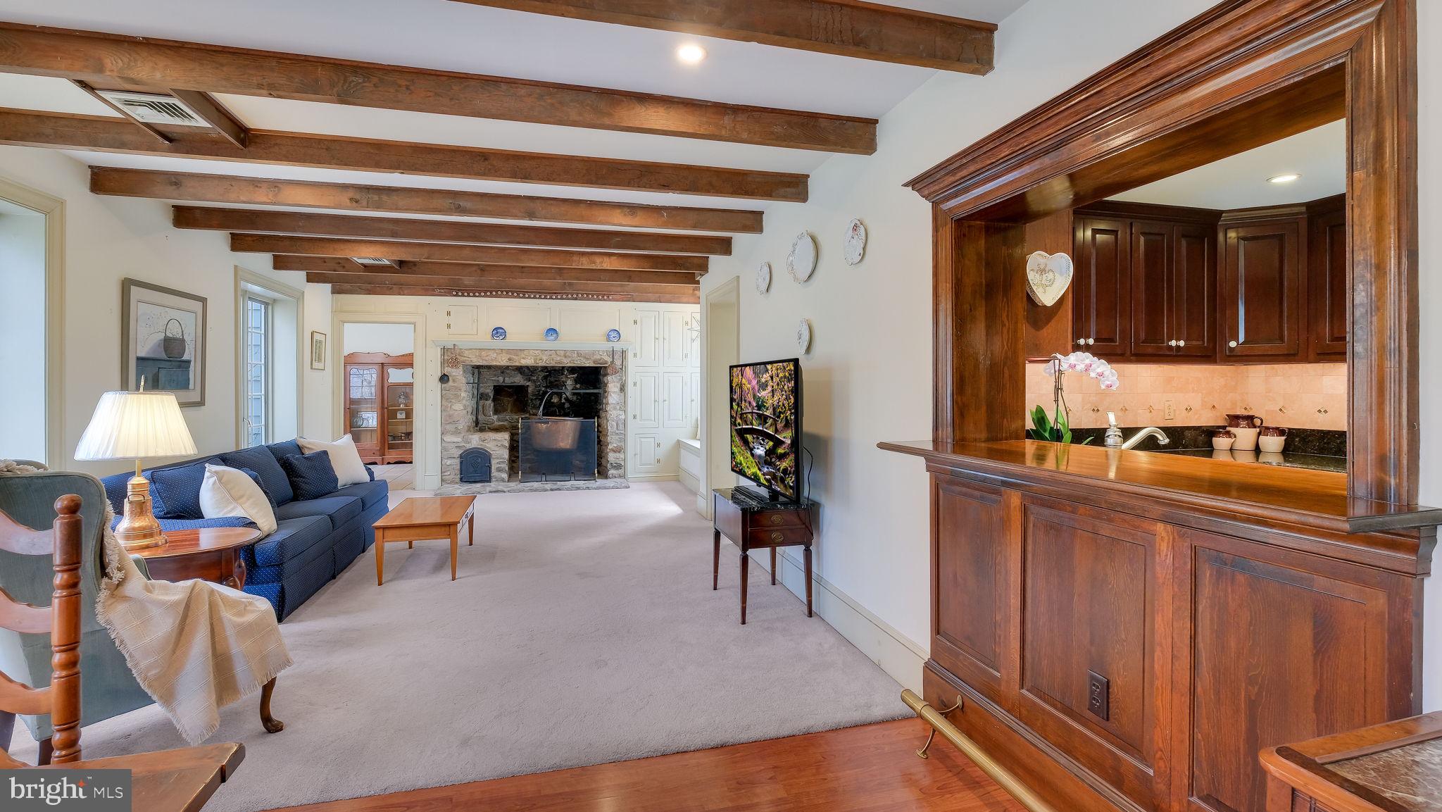 563 Pebble Hill Road Doylestown, PA 18901 - Photo 22 of 81 a living room with furniture and a fireplace