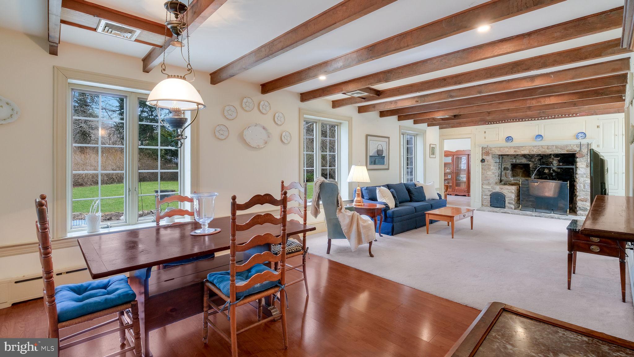 563 Pebble Hill Road Doylestown, PA 18901 - Photo 23 of 81 a living room with furniture a large window and potted plants