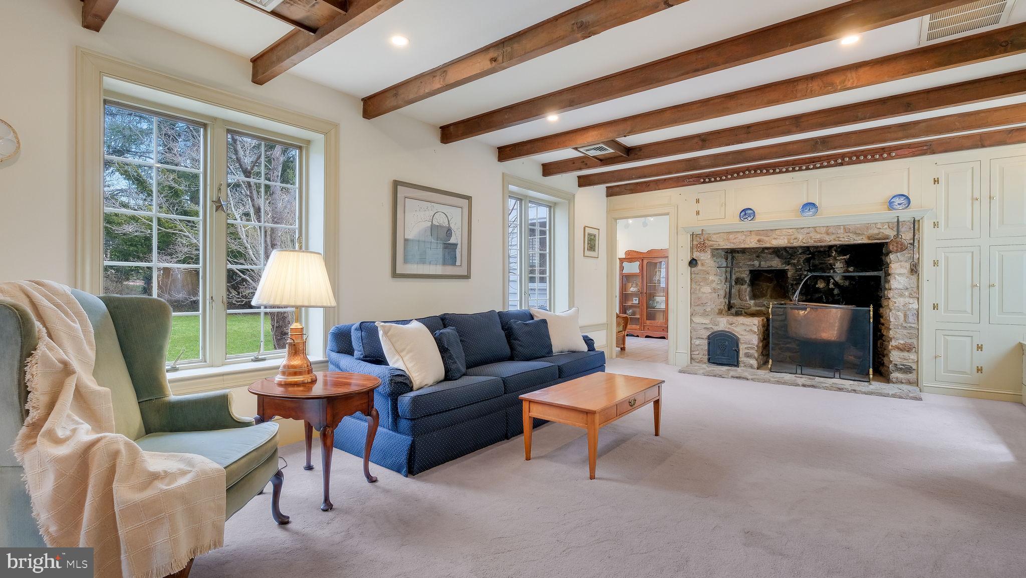563 Pebble Hill Road Doylestown, PA 18901 - Photo 24 of 81 a living room with furniture and a fireplace