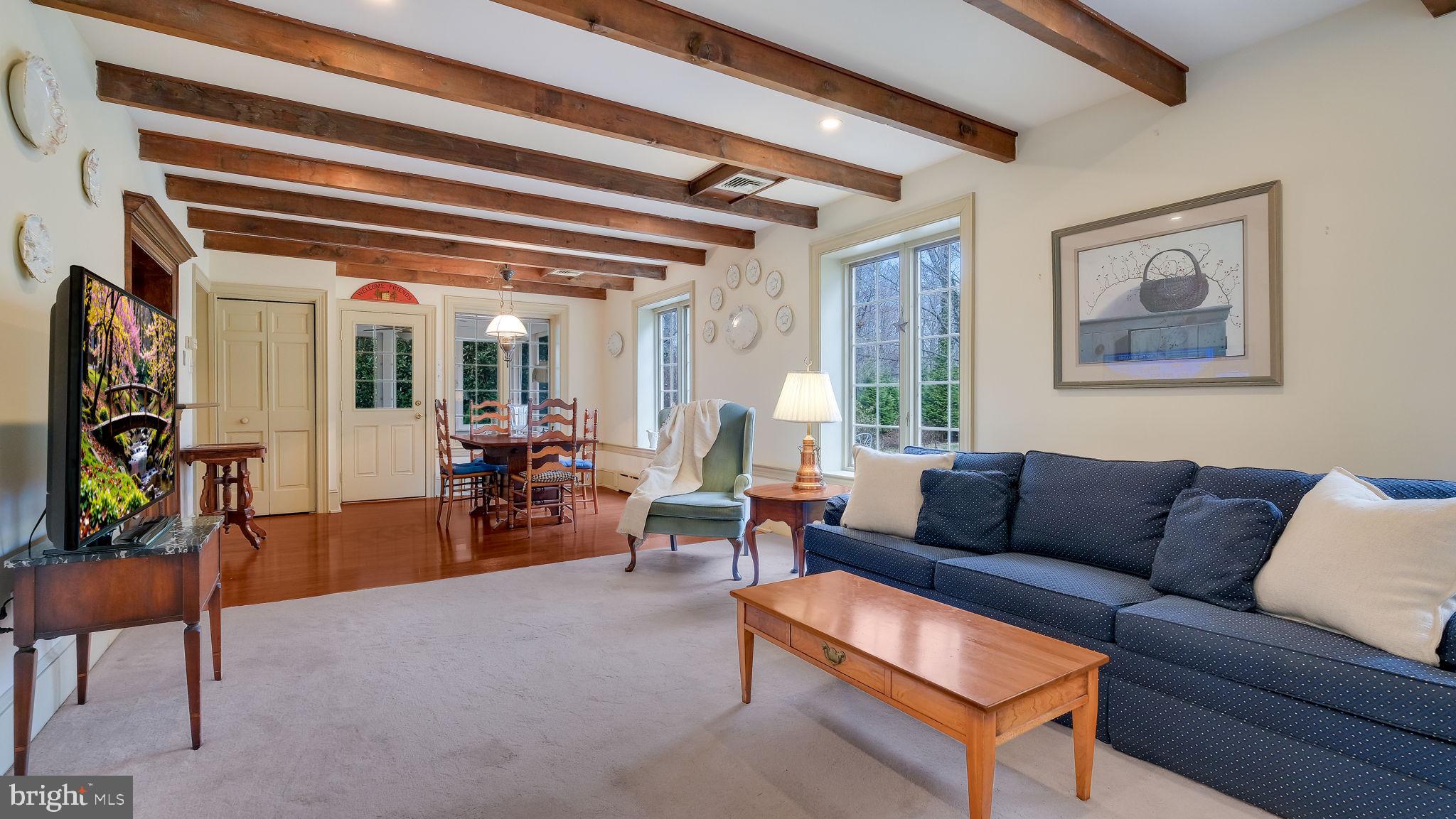 563 Pebble Hill Road Doylestown, PA 18901 - Photo 26 of 81 a living room with furniture and a potted plant