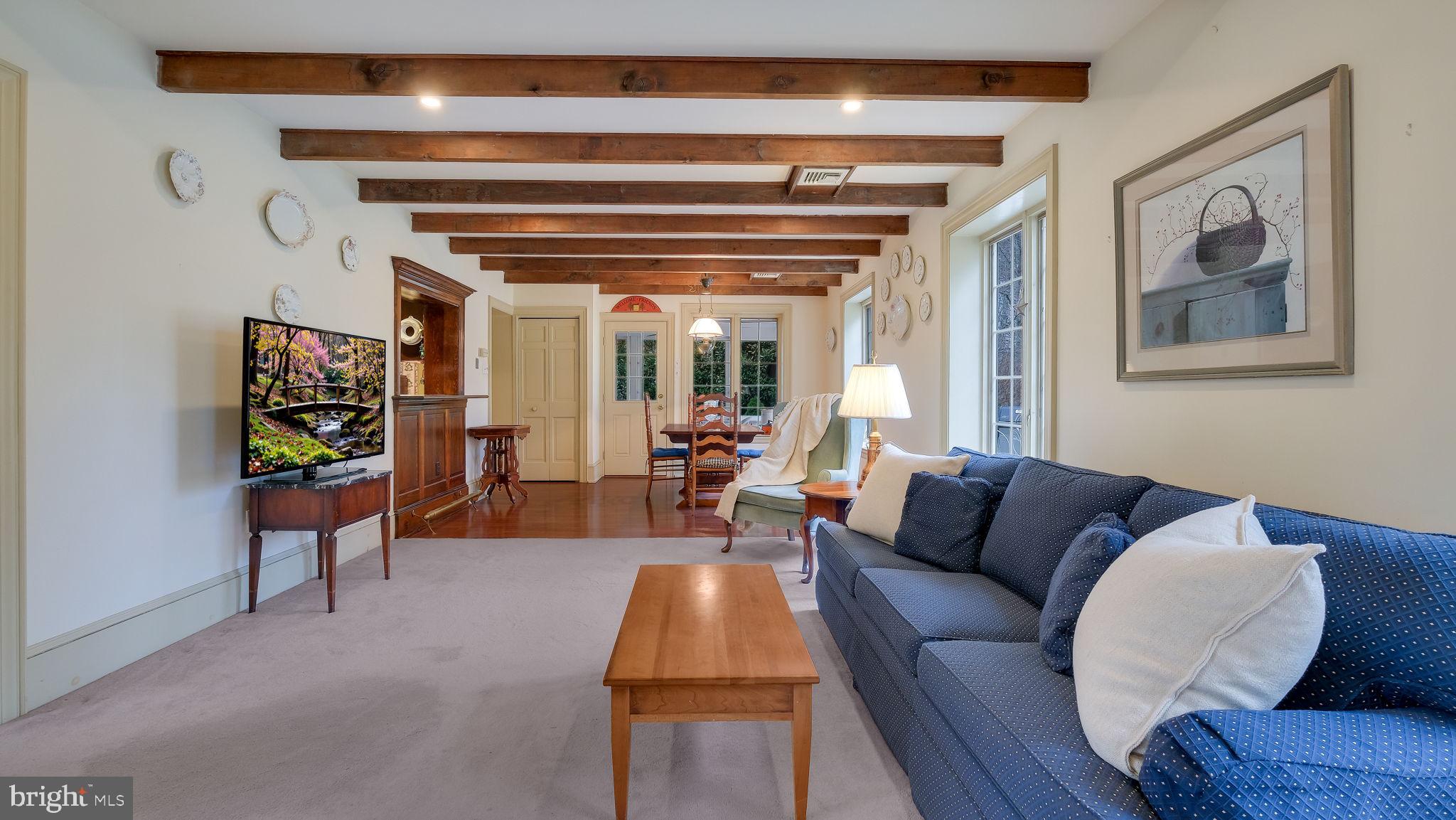 563 Pebble Hill Road Doylestown, PA 18901 - Photo 27 of 81 a living room with furniture and a potted plant