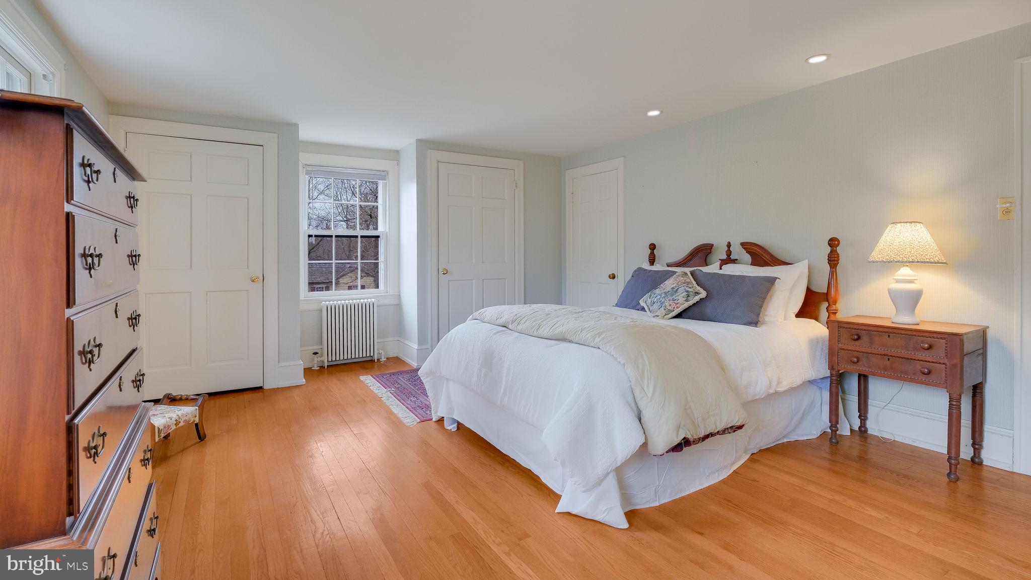 563 Pebble Hill Road Doylestown, PA 18901 - Photo 37 of 81 a bedroom with a bed and a table in it