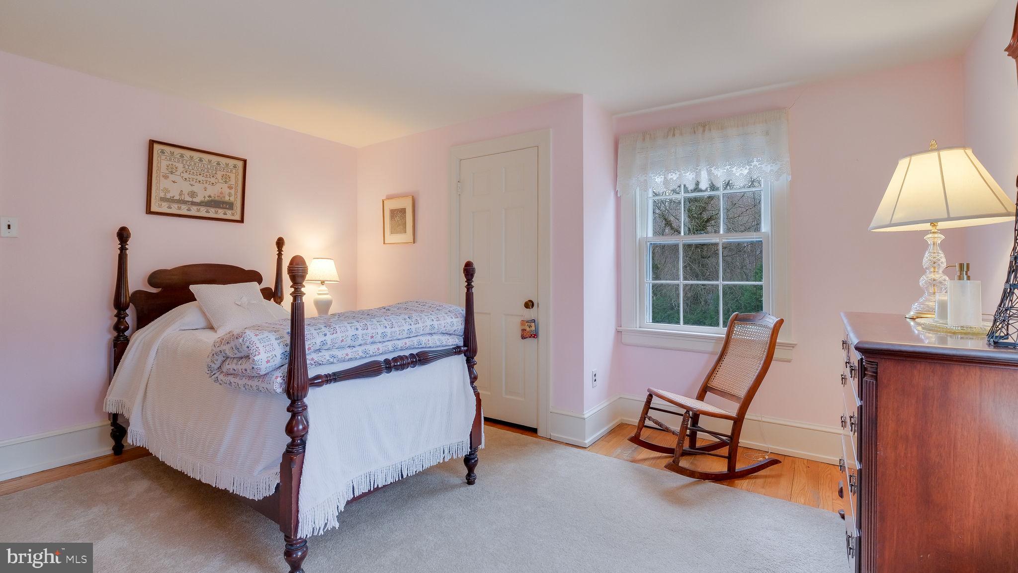 563 Pebble Hill Road Doylestown, PA 18901 - Photo 41 of 81 a bed room with a bed and a chair