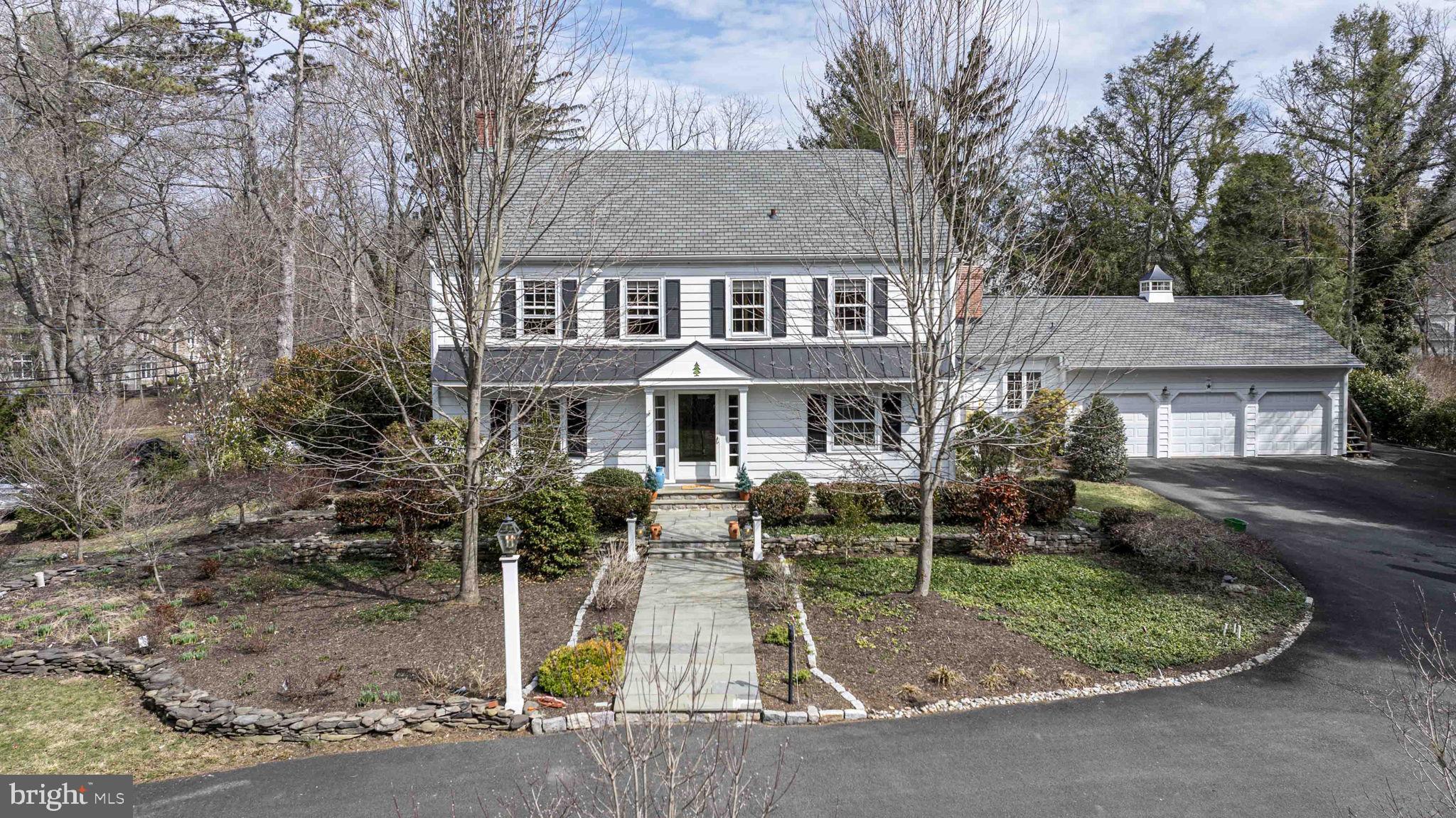 563 Pebble Hill Road Doylestown, PA 18901 - Photo 60 of 81 a front view of a house with a yard table and chairs