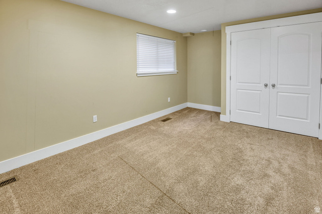 1320 Canyon Park Road Bountiful, UT 84010 - Photo 21 of 28 Unfurnished bedroom featuring light carpet, a closet, and recessed lighting