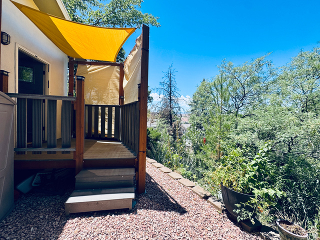 150 North 3050 East, Unit 4 St. George, UT 84790 - Photo 22 of 24 Outdoor deck featuring a wood-finish railing, steps, and a sun shade canopy