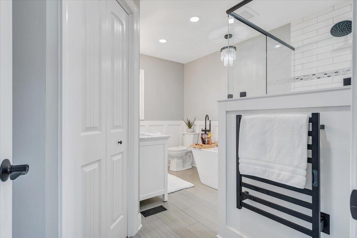155 Mallard Cove Road Moneta, VA 24121 - Photo 19 of 51 a bathroom with a sink a toilet and a shower