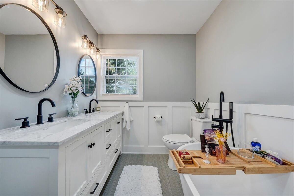 155 Mallard Cove Road Moneta, VA 24121 - Photo 21 of 51 a bathroom with a sink and a mirror