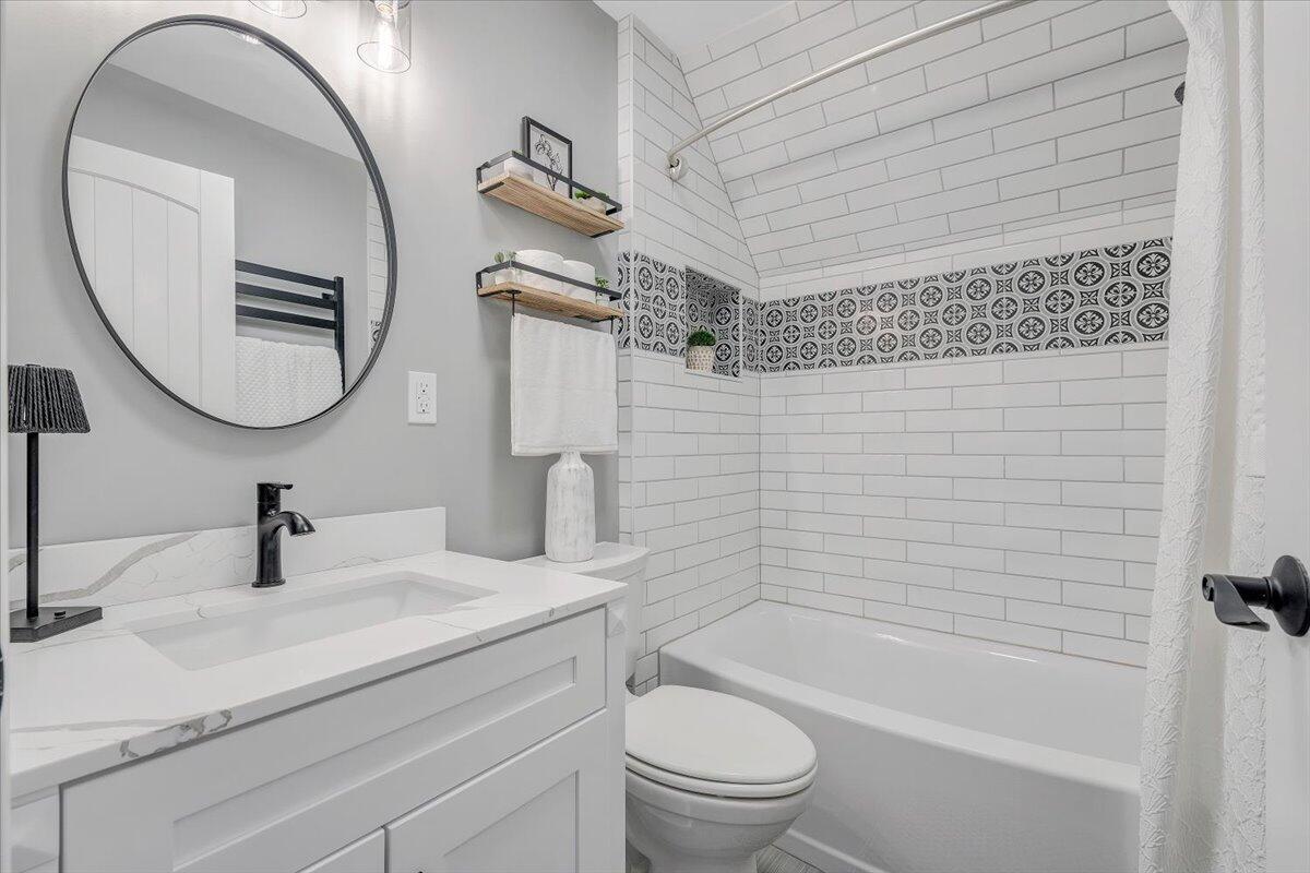 155 Mallard Cove Road Moneta, VA 24121 - Photo 24 of 51 a bathroom with a sink a toilet and a mirror