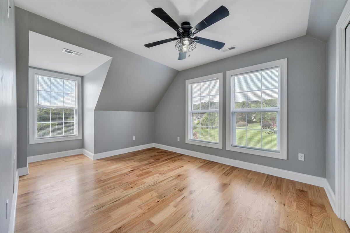 155 Mallard Cove Road Moneta, VA 24121 - Photo 25 of 51 a view of an empty room with a window and wooden floor