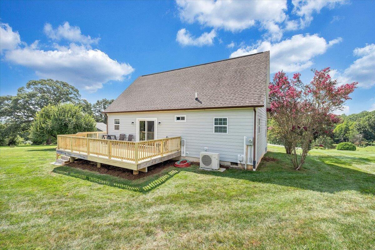 155 Mallard Cove Road Moneta, VA 24121 - Photo 37 of 51 a front view of a house with garden