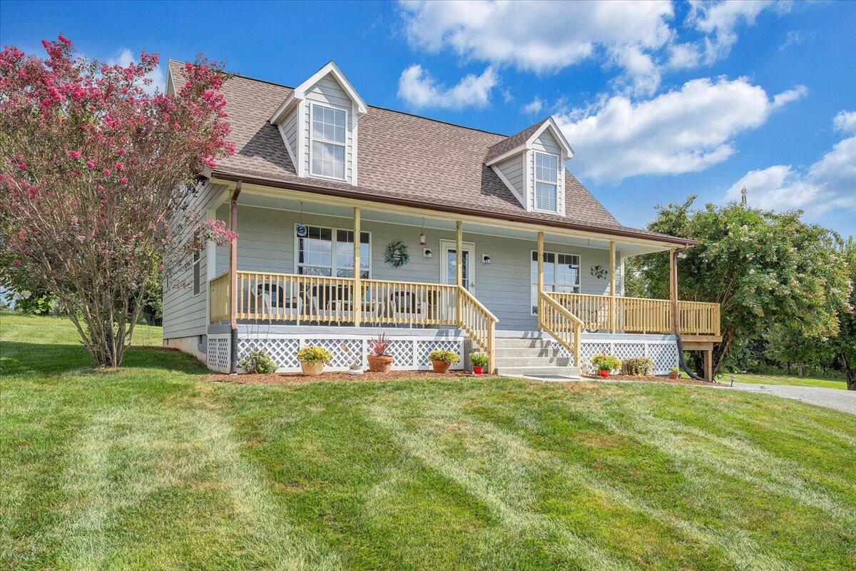 155 Mallard Cove Road Moneta, VA 24121 - Photo 4 of 51 a view of a house with a big yard and large trees