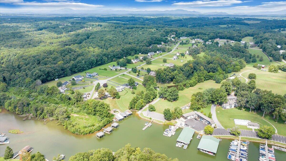 155 Mallard Cove Road Moneta, VA 24121 - Photo 47 of 51 a view of a lake with mountains in the back