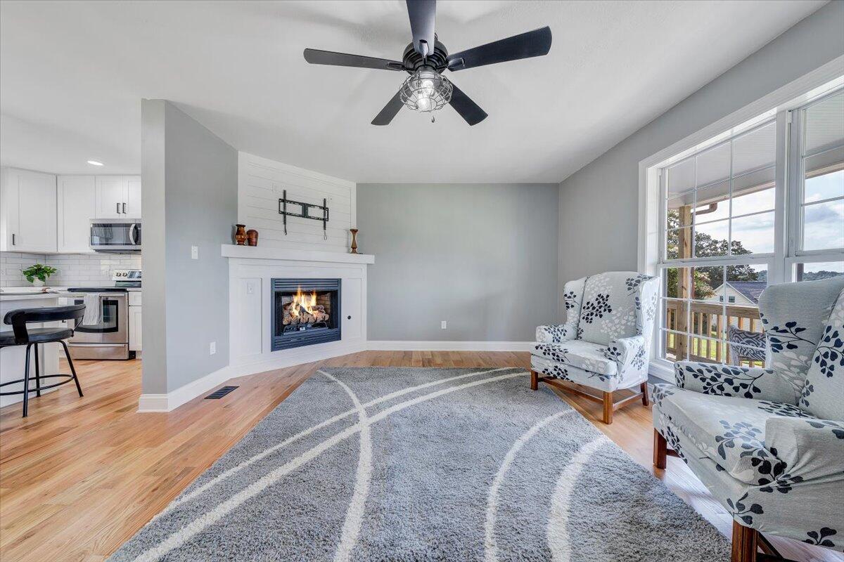 155 Mallard Cove Road Moneta, VA 24121 - Photo 5 of 51 a bedroom with a bed and a fireplace