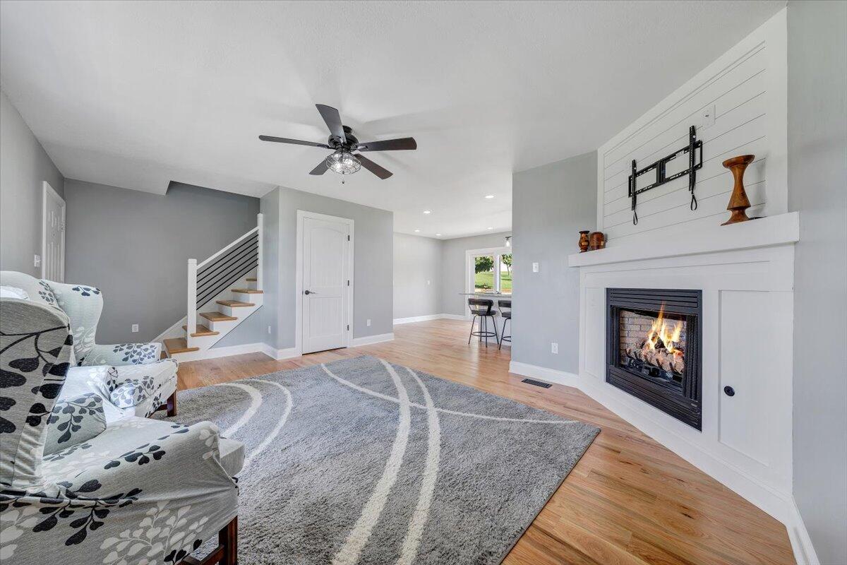 155 Mallard Cove Road Moneta, VA 24121 - Photo 6 of 51 a living room with furniture and a fireplace