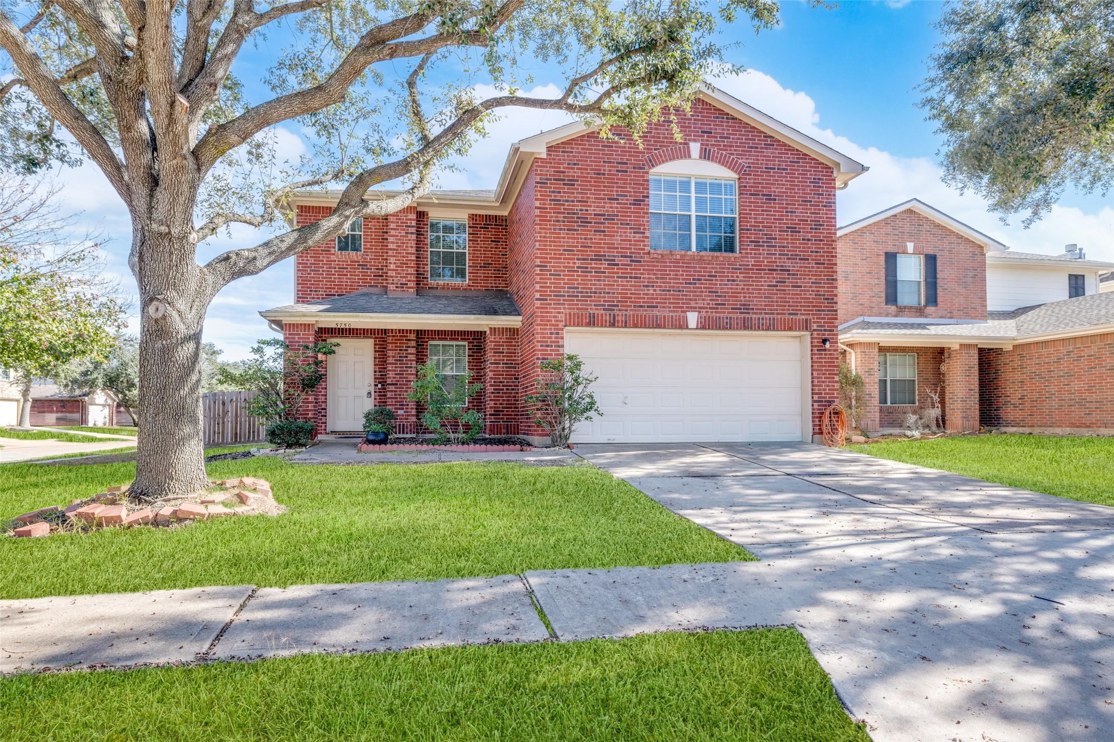 5750 Roehampton Court Houston, TX 77084 - Photo 1 of 25 a front view of a house with a yard and garage