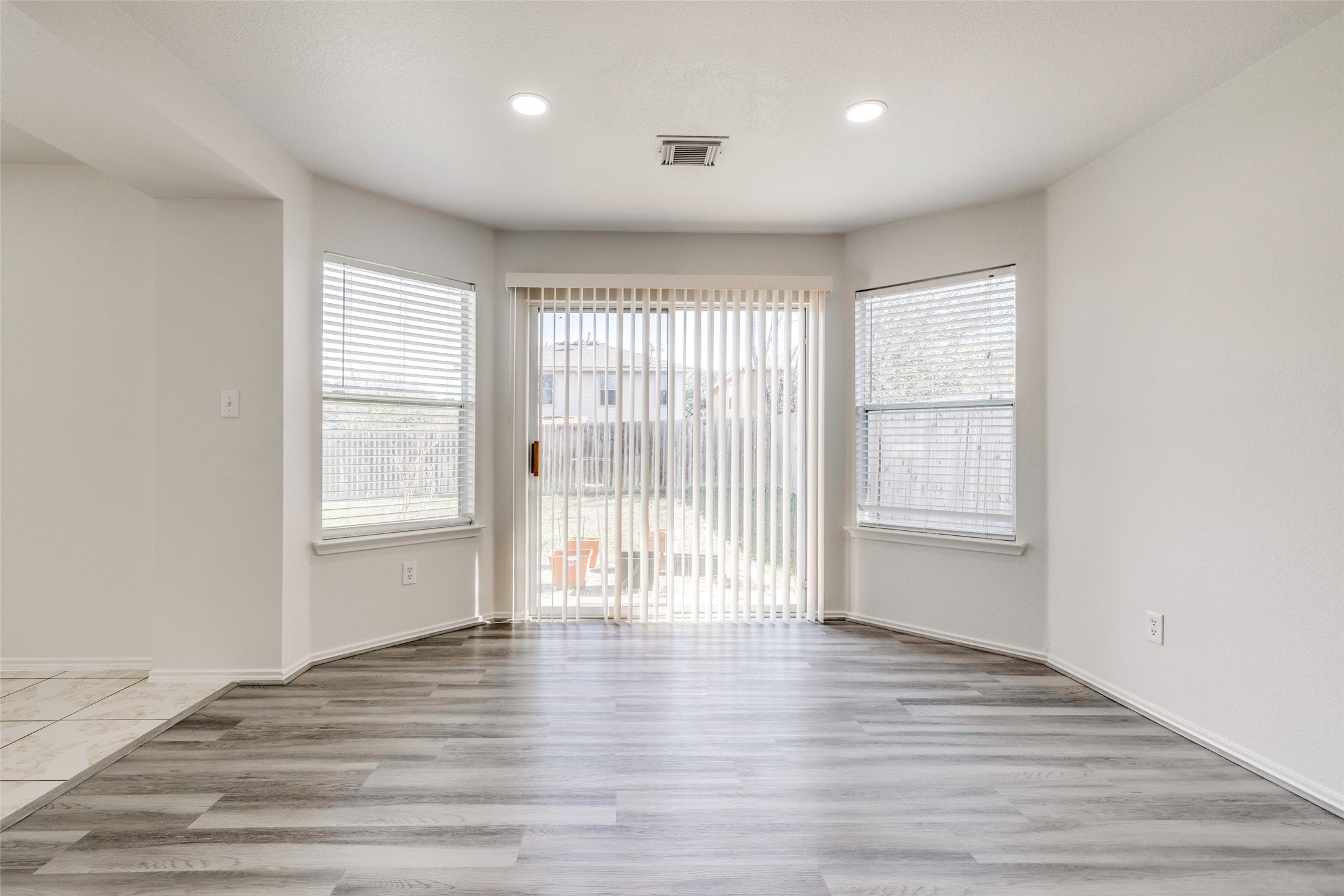 5750 Roehampton Court Houston, TX 77084 - Photo 11 of 25 wooden floor in an empty room with a window