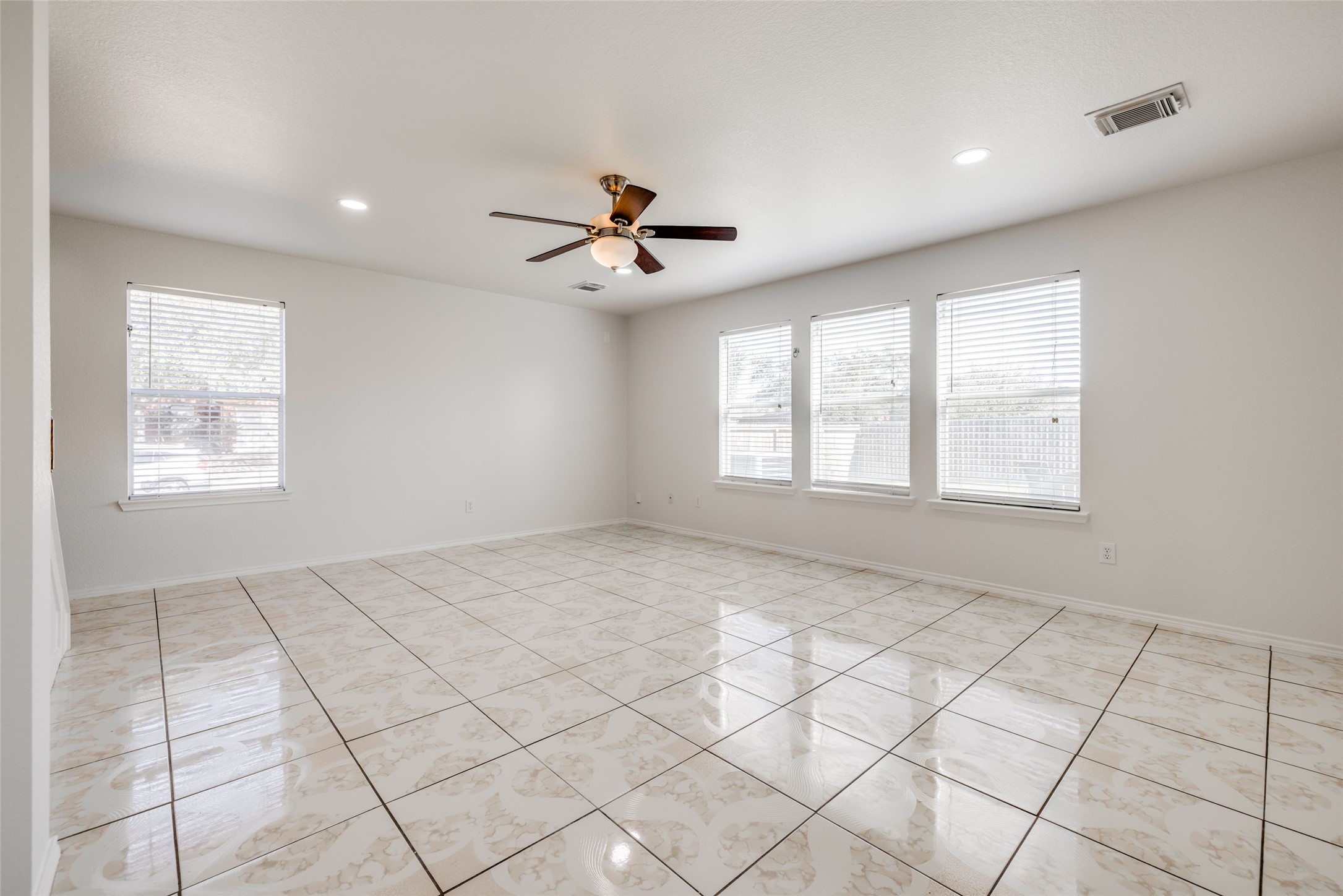 5750 Roehampton Court Houston, TX 77084 - Photo 12 of 25 a view of an empty room with a window