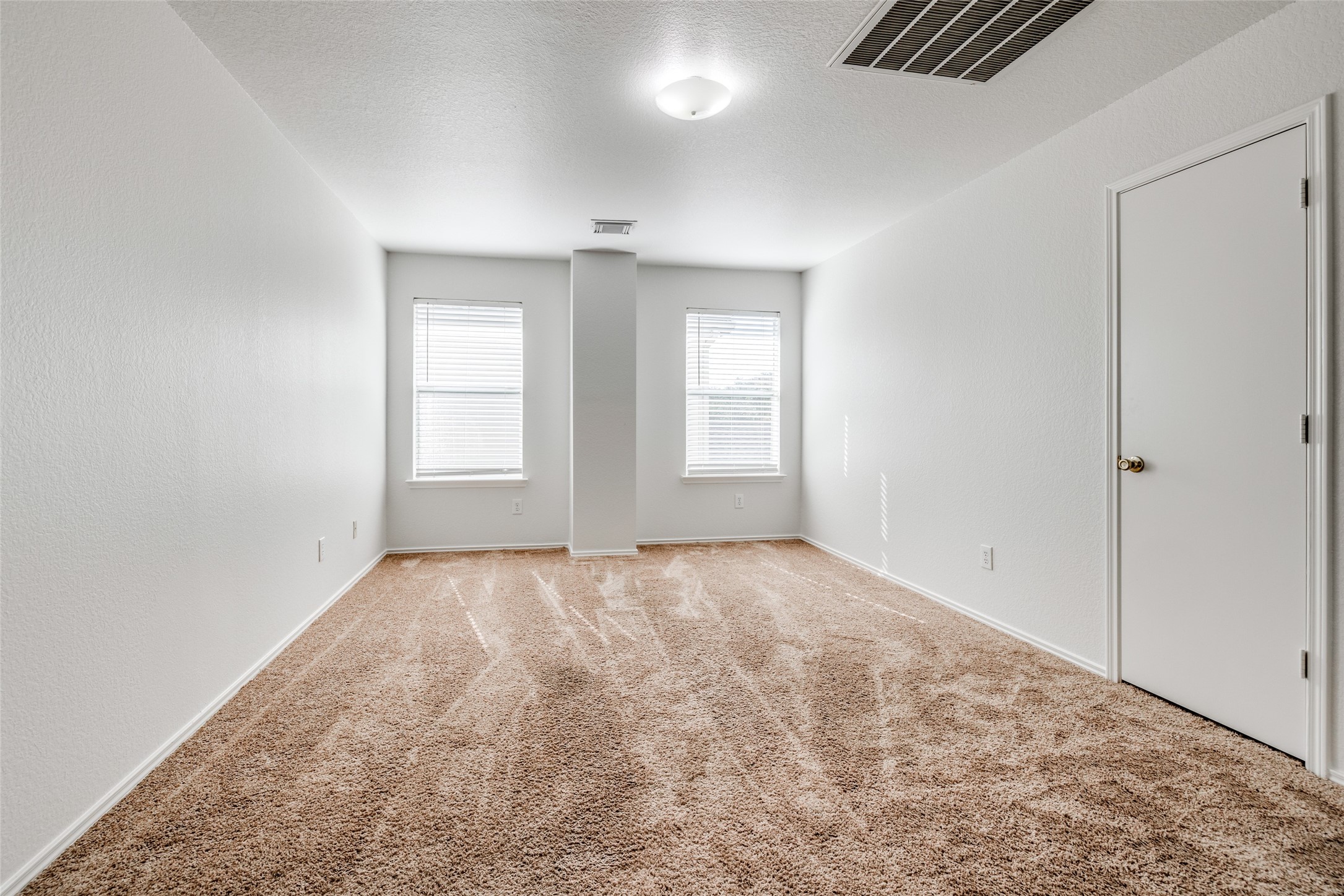 5750 Roehampton Court Houston, TX 77084 - Photo 15 of 25 an empty room with windows