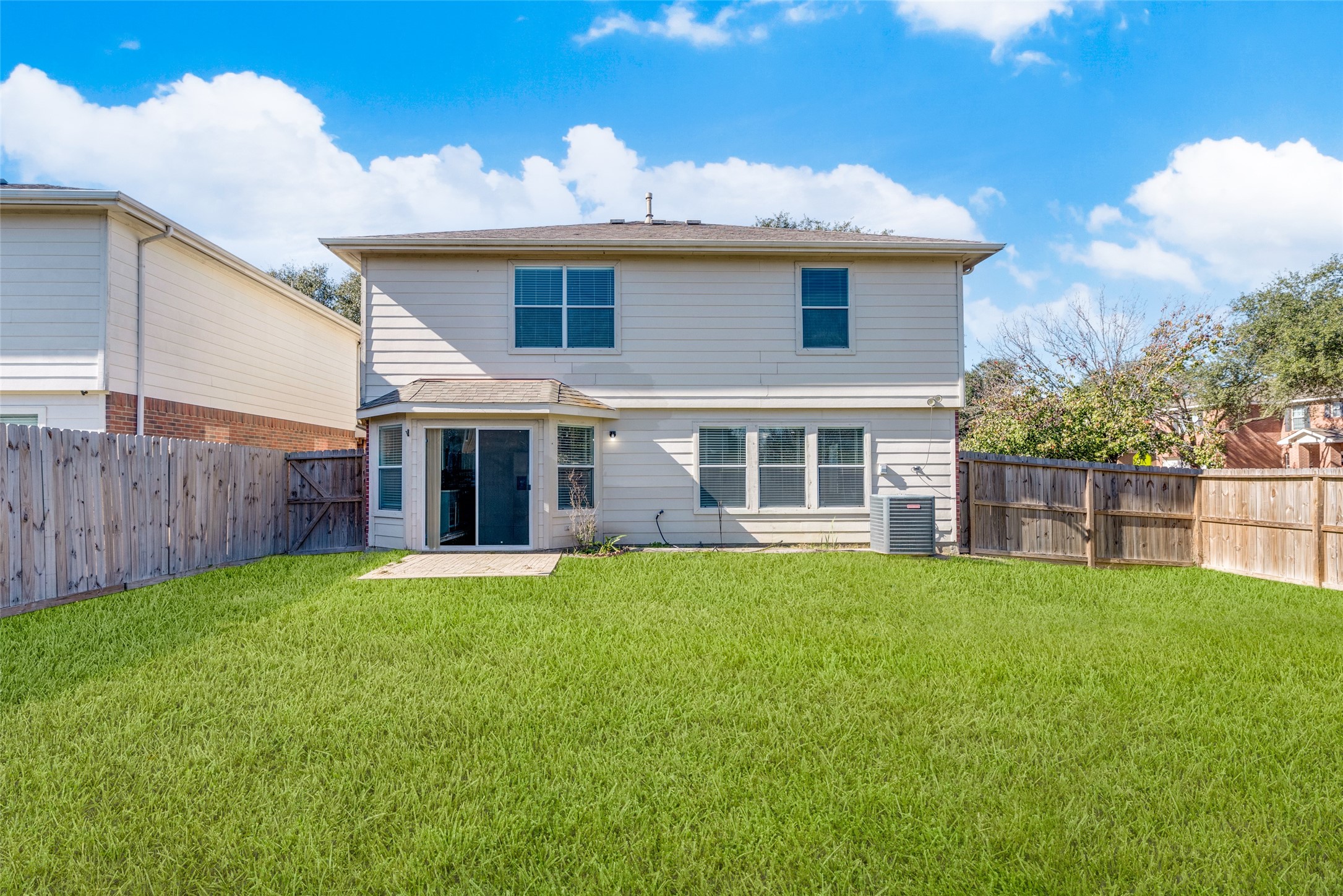 5750 Roehampton Court Houston, TX 77084 - Photo 24 of 25 a view of a house with a yard and sitting area