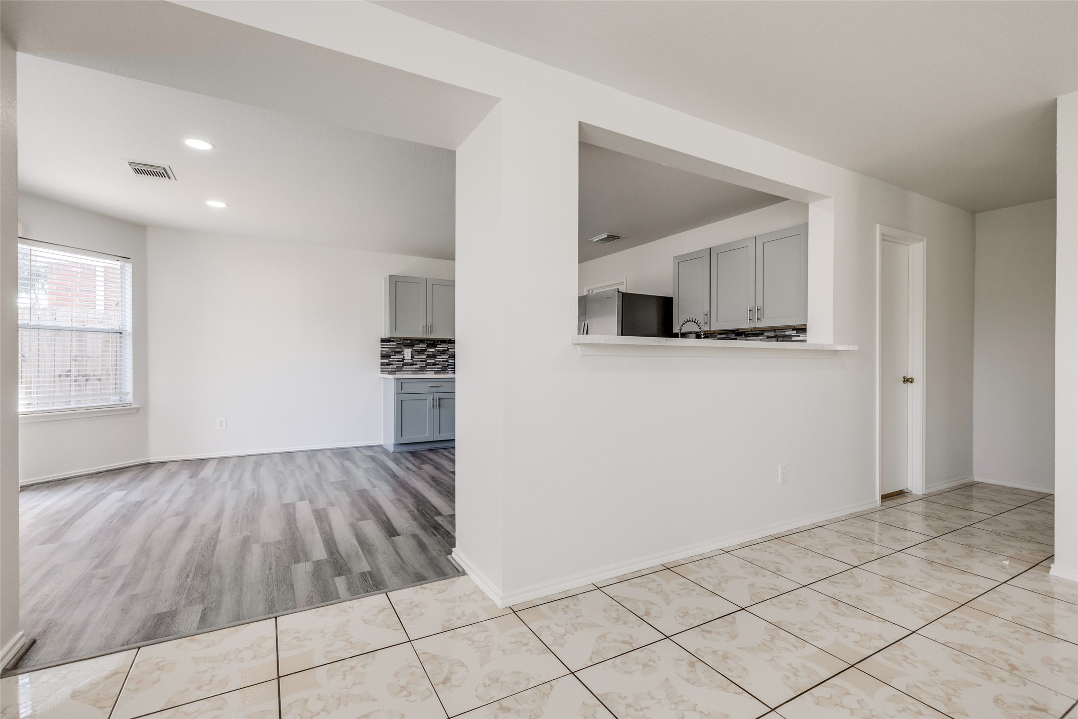 5750 Roehampton Court Houston, TX 77084 - Photo 7 of 25 a view of a livingroom with wooden floor