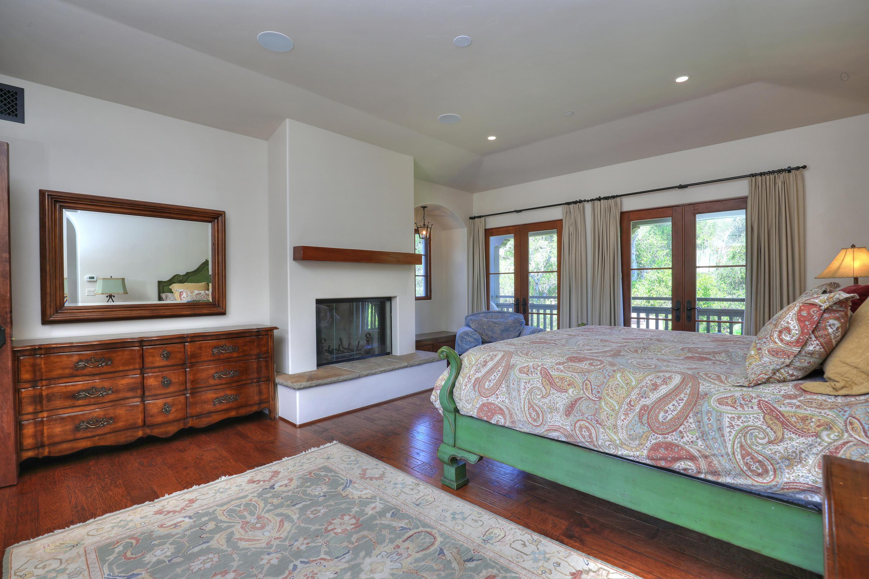 311 Ennisbrook Drive Montecito, CA 93108 - Photo 14 of 31 a bed room with furniture and a fireplace