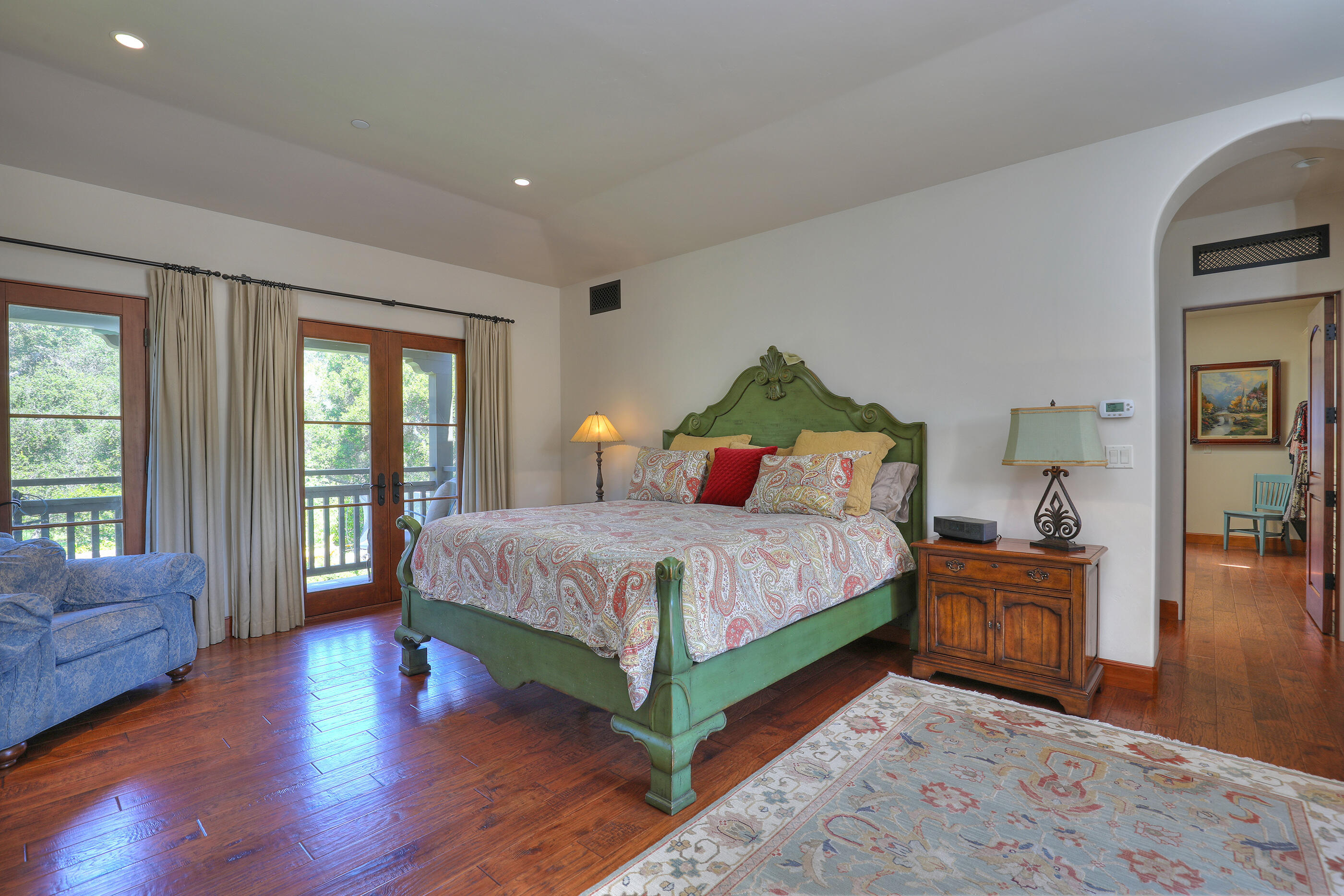 311 Ennisbrook Drive Montecito, CA 93108 - Photo 15 of 31 a bedroom with a bed and wooden floor