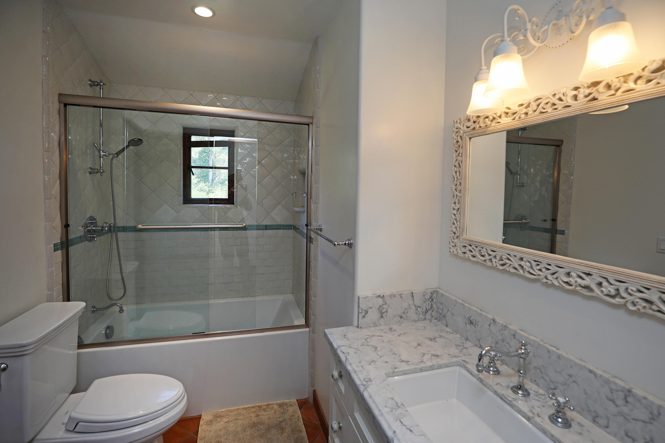 311 Ennisbrook Drive Montecito, CA 93108 - Photo 20 of 31 a bathroom with a granite countertop sink toilet and shower