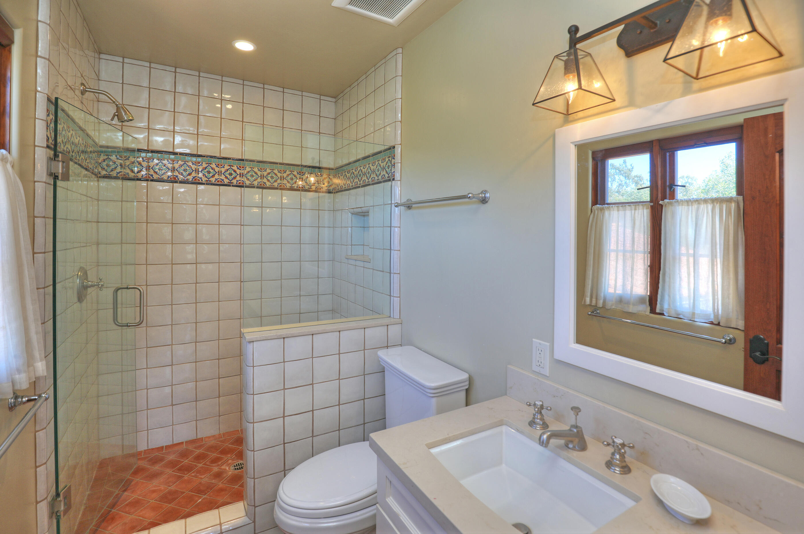 311 Ennisbrook Drive Montecito, CA 93108 - Photo 22 of 31 a bathroom with a sink a toilet and shower