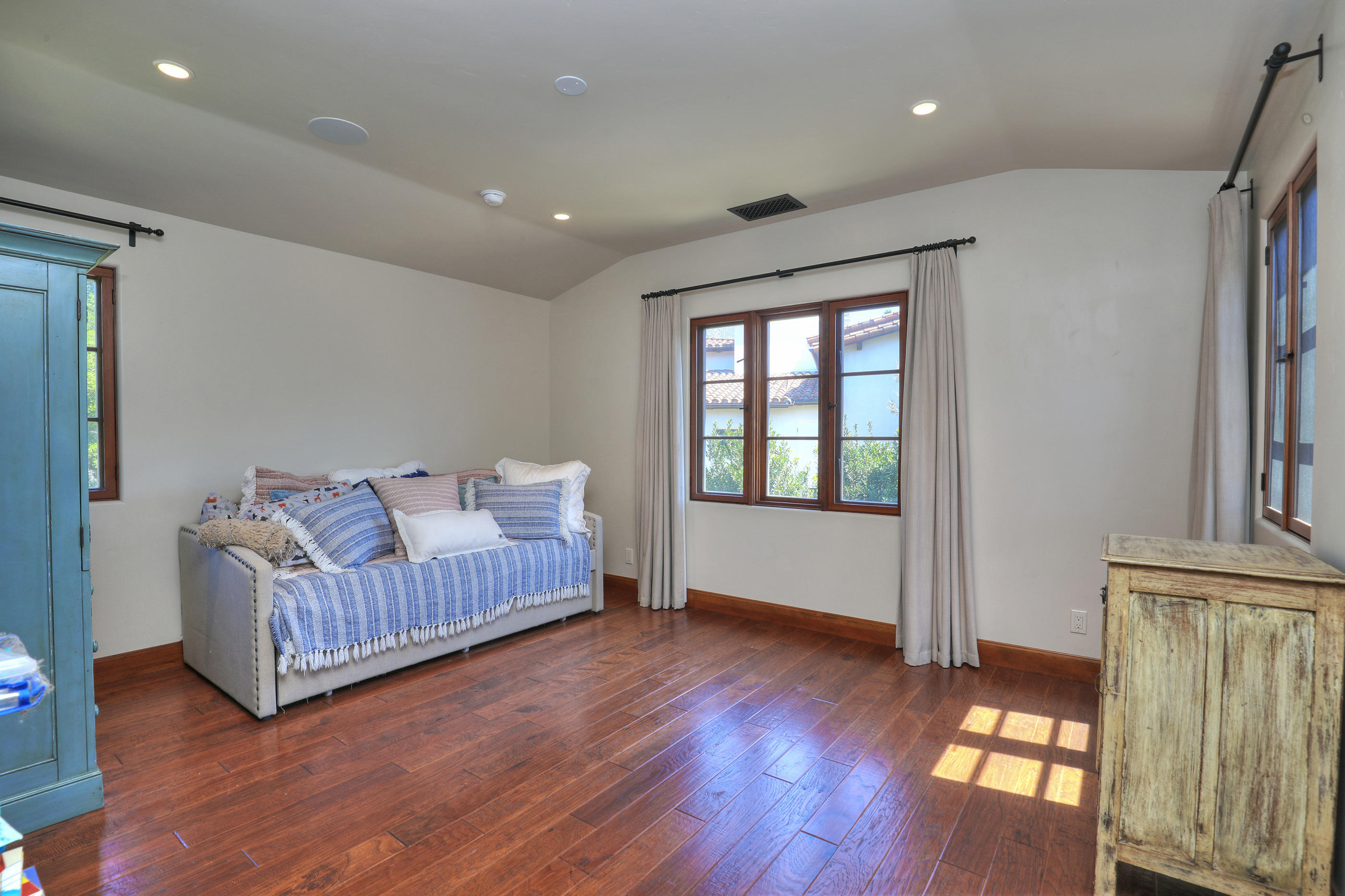 311 Ennisbrook Drive Montecito, CA 93108 - Photo 23 of 31 a living room with a bed furniture and a window