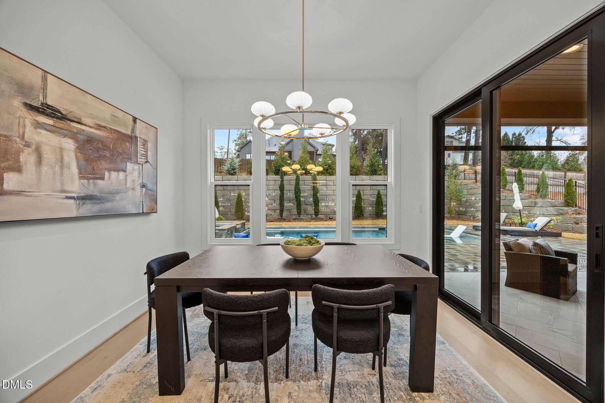 861 Wimbleton Drive Raleigh, NC 27609 - Photo 19 of 64 a view of a dining room with furniture wooden floor and chandelier
