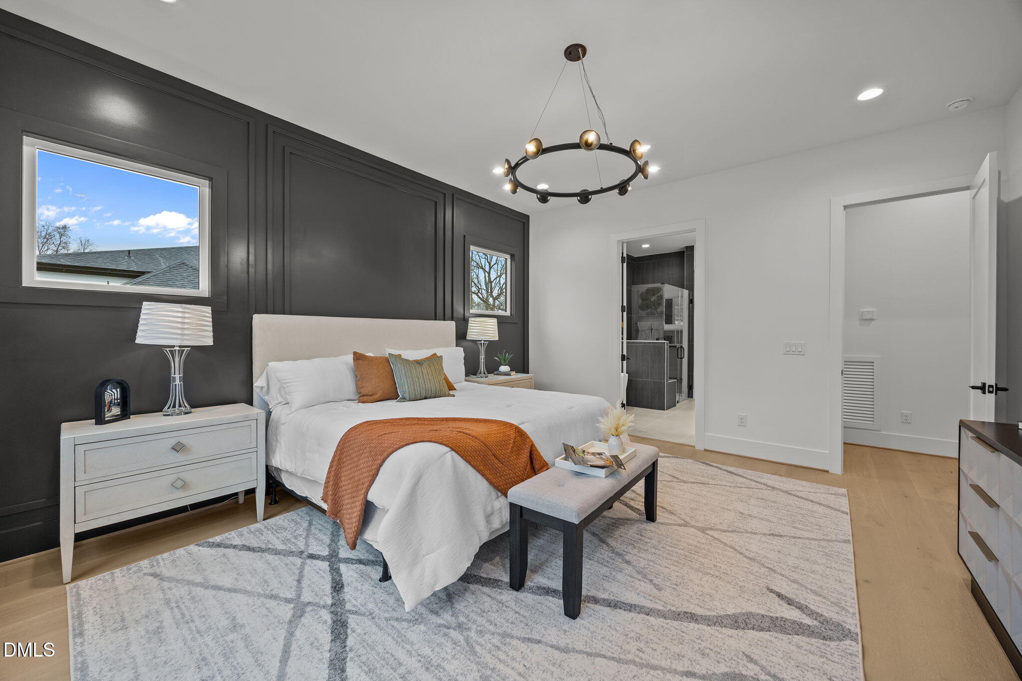 861 Wimbleton Drive Raleigh, NC 27609 - Photo 25 of 62 a bedroom with a bed and a chandelier