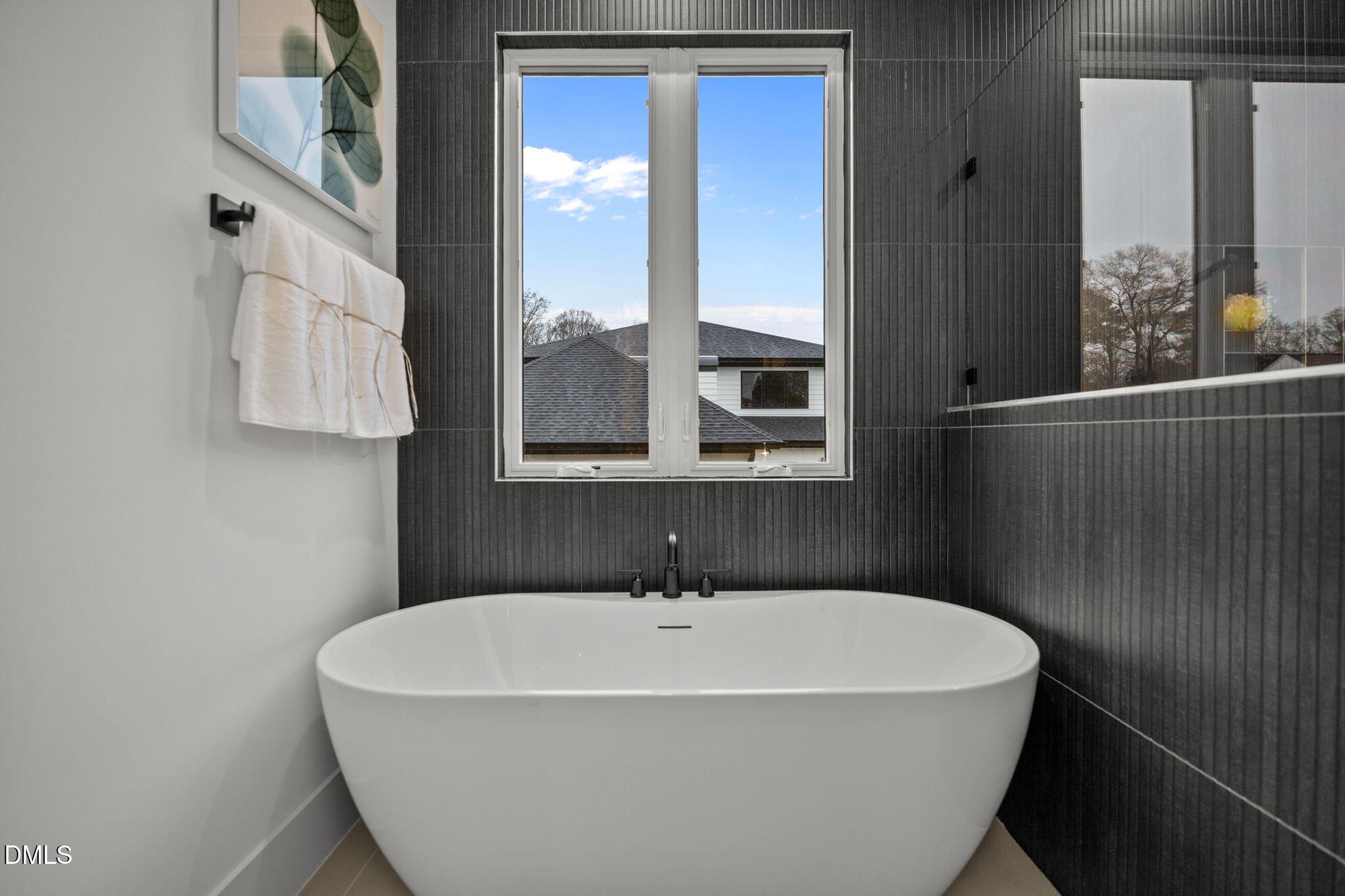 861 Wimbleton Drive Raleigh, NC 27609 - Photo 27 of 64 a white bath tub sitting in a bathroom next to a window